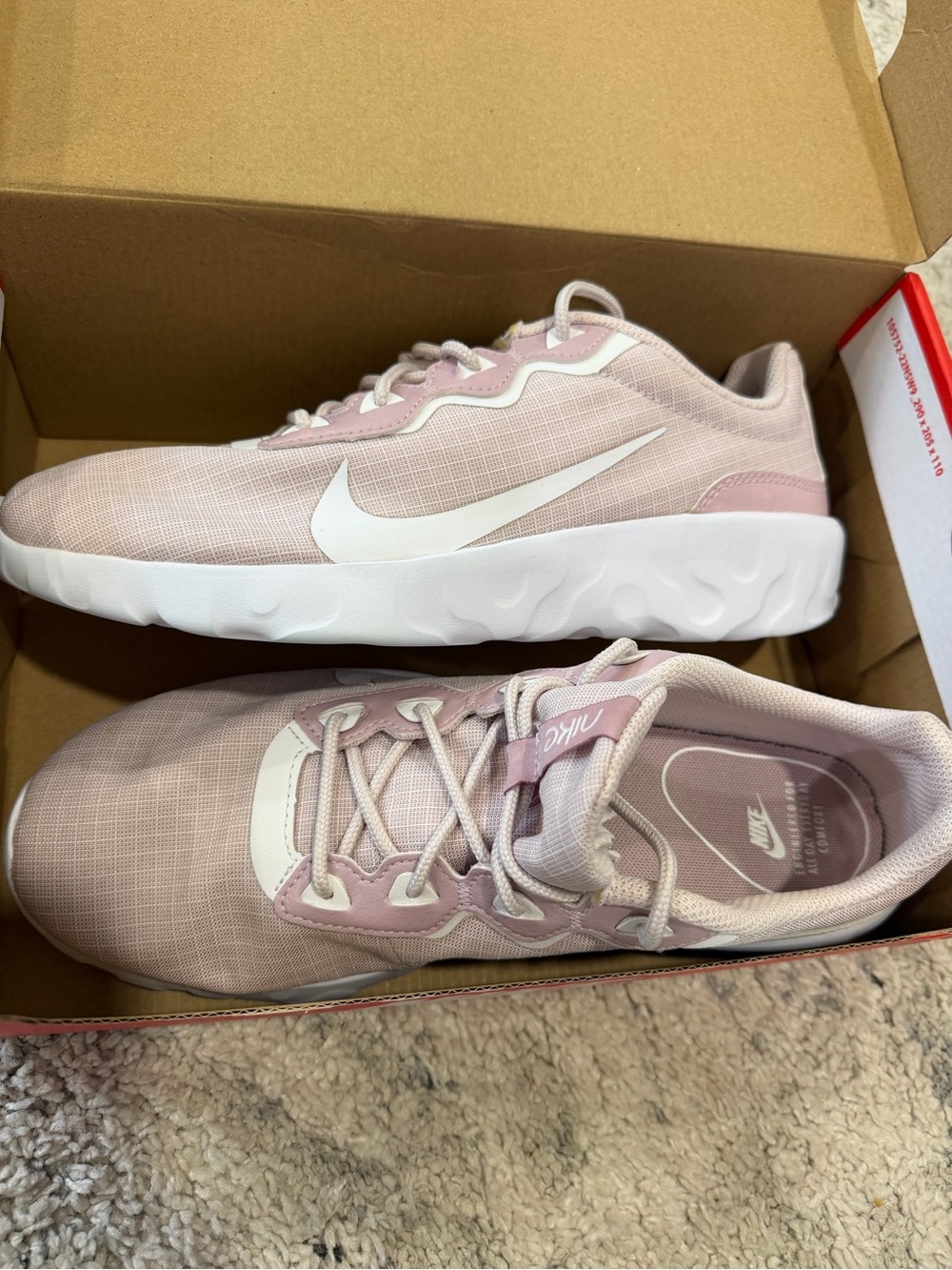 Nike Women's Light Pink Athletic Sneakers with White Swoosh